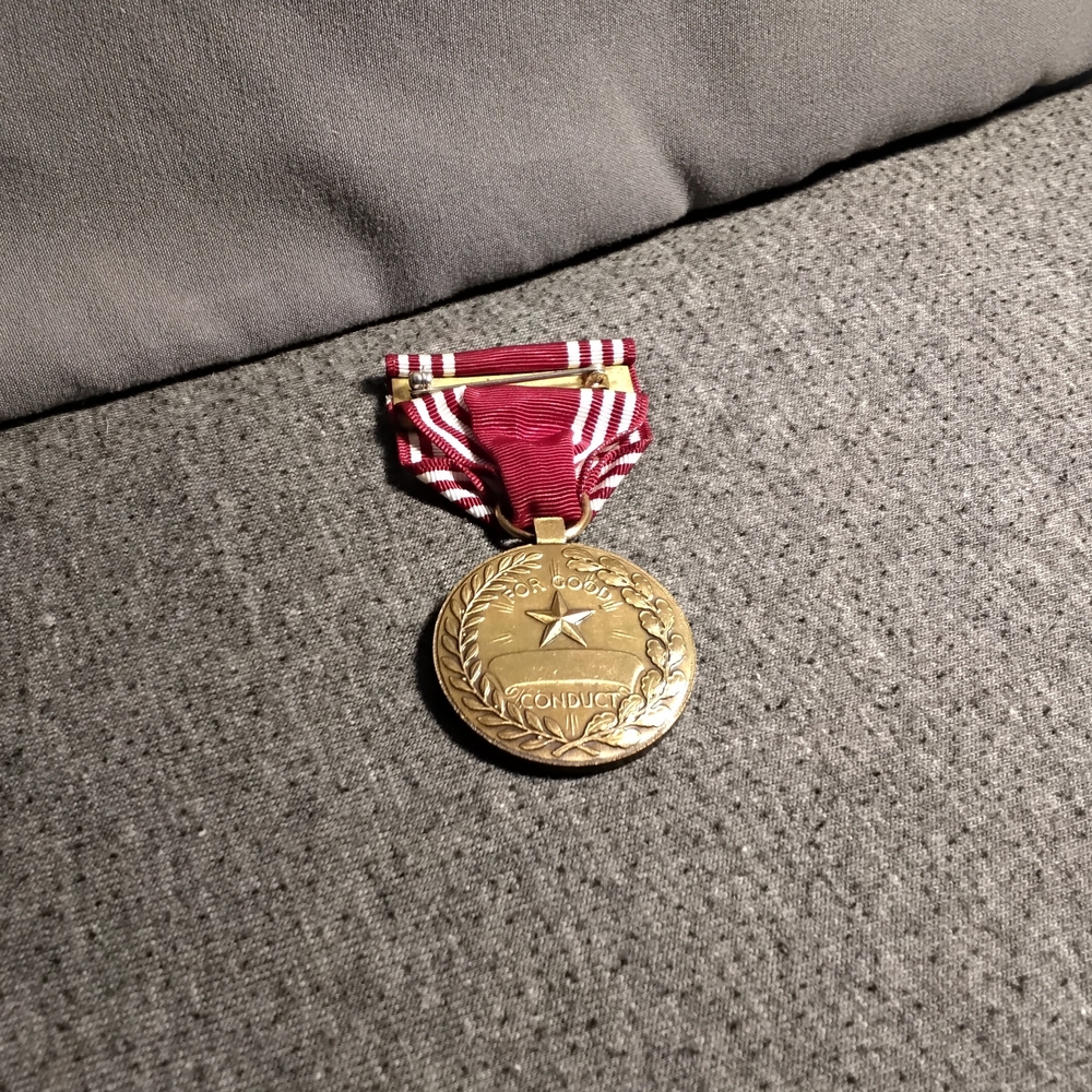 Gold Medal with Red Ribbon